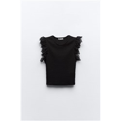 TEXTURED TOP WITH RUFFLE TRIMS