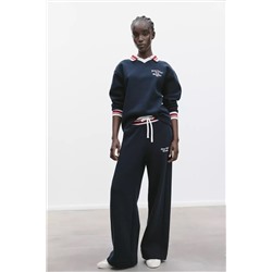 TROUSERS WITH EMBROIDERED SLOGAN