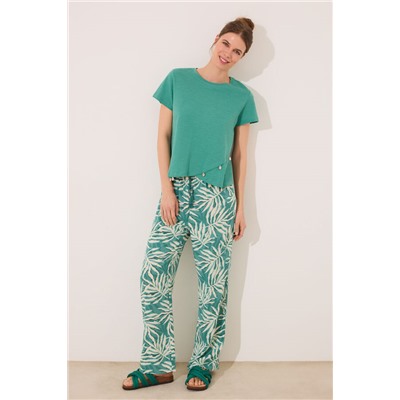 Pantalón largo estampado hojas verde