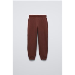TROUSERS WITH EMBROIDERED SLOGAN