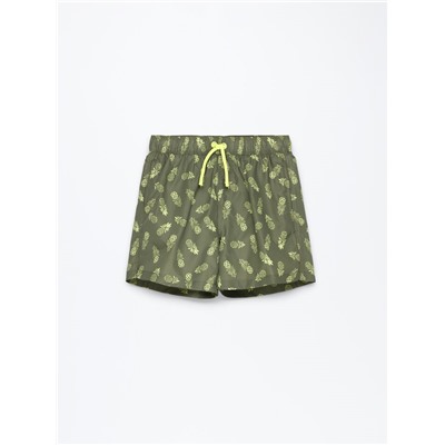 Tropical print swimming trunks