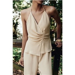 HALTER TWO-PIECE EFFECT JUMPSUIT