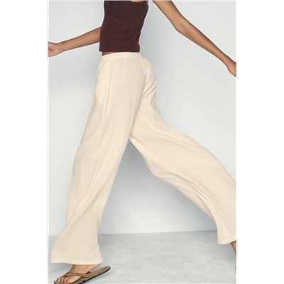 CREASED-EFFECT WIDE-LEG TROUSERS