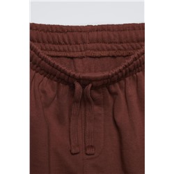 TROUSERS WITH EMBROIDERED SLOGAN