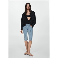 Jeans slim capri costuras decorativas