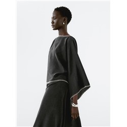 Cape blouse with batwing sleeves