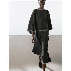 Cape blouse with batwing sleeves