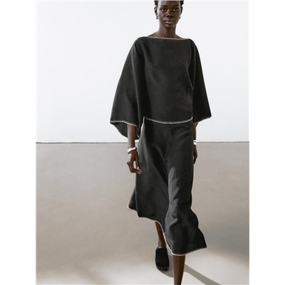 Cape blouse with batwing sleeves