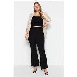 Trendyol Curve Siyah İspanyol Paça Yırtmaçlı Örme Pantolon TBBAW23AR00030