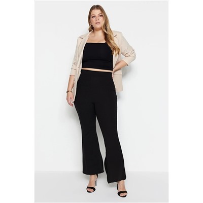 Trendyol Curve Siyah İspanyol Paça Yırtmaçlı Örme Pantolon TBBAW23AR00030