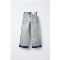 FLARED JEANS WITH RAW HEMS
