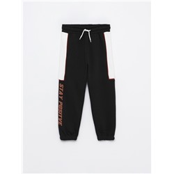 TRACKSUIT BOTTOMS WITH SIDE TAPING