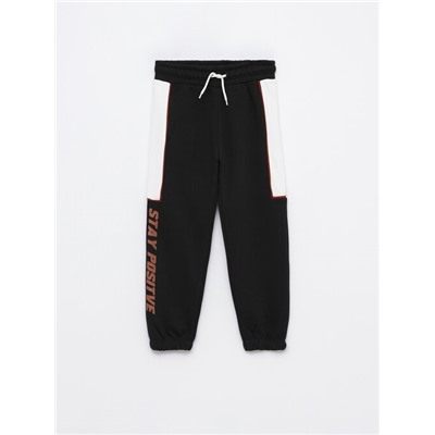 TRACKSUIT BOTTOMS WITH SIDE TAPING
