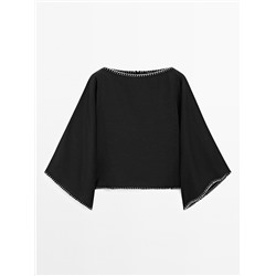 Cape blouse with batwing sleeves