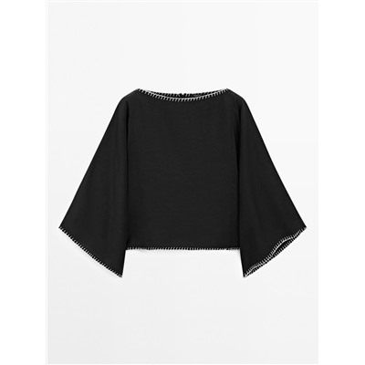 Cape blouse with batwing sleeves