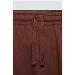 TROUSERS WITH EMBROIDERED SLOGAN