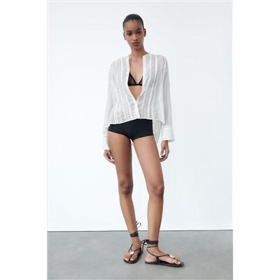 BLUSA BAJO ASIMÉTRICO