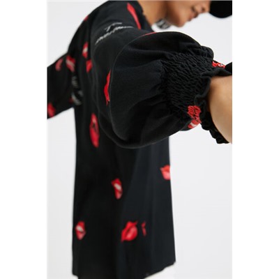 Blusa vaporosa bocas