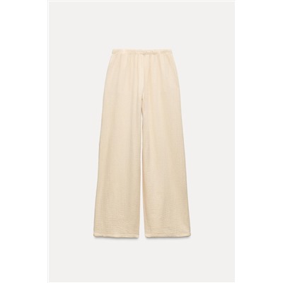 CREASED-EFFECT WIDE-LEG TROUSERS