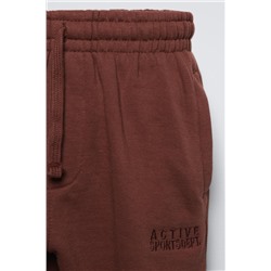 TROUSERS WITH EMBROIDERED SLOGAN