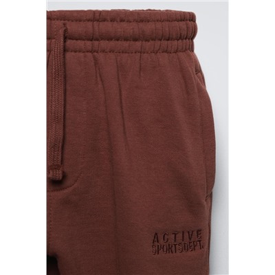 TROUSERS WITH EMBROIDERED SLOGAN