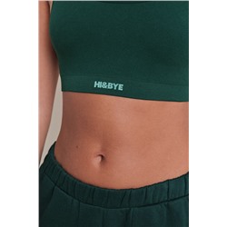 Top deportivo seamless canalé verde oscuro