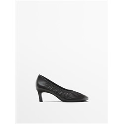 Gathered high heel shoes