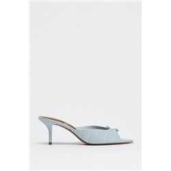 TEXTURED BUCKLE HEELED MULES