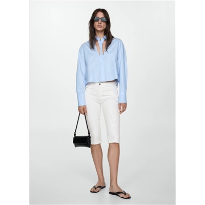 Jeans slim capri costuras decorativas