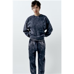 FADED-EFFECT CARROT FIT PLUSH TROUSERS