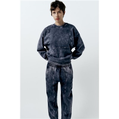 FADED-EFFECT CARROT FIT PLUSH TROUSERS