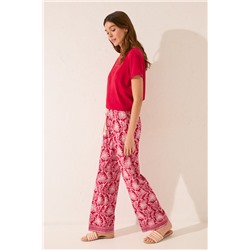 Pantalón largo viscosa estampado hojas rojo
