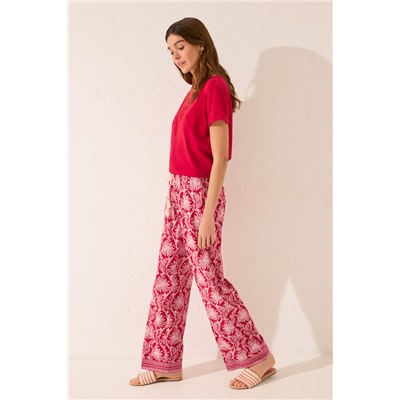 Pantalón largo viscosa estampado hojas rojo
