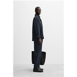 TEXTURED PLEATED TROUSERS