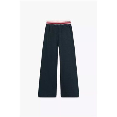 TROUSERS WITH EMBROIDERED SLOGAN