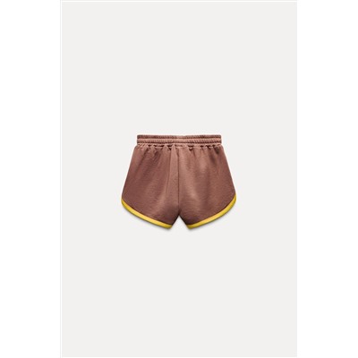 VARSITY SHORTS WITH SLOGAN