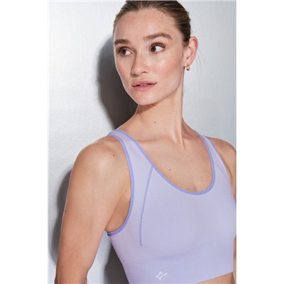 Sujetador deportivo reversible lila y blanco