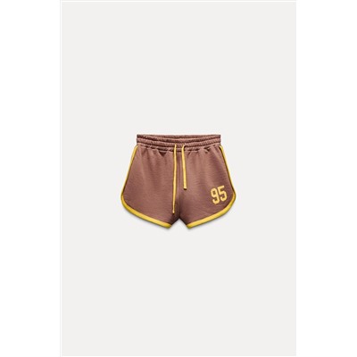 VARSITY SHORTS WITH SLOGAN
