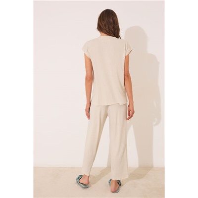 Conjunto pantalón y camiseta marfil lurex
