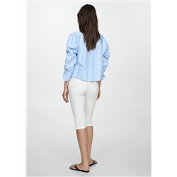 Jeans slim capri costuras decorativas