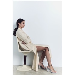 METALLIC SANDAL WITH SEASHELL HEEL