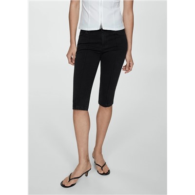 Jeans slim capri costuras decorativas