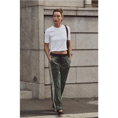 TROUSERS WITH SIDE TAPING