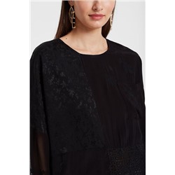 Blusa oversize transparencias