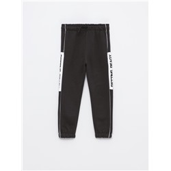TRACKSUIT BOTTOMS WITH SIDE TAPING