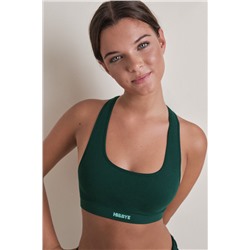 Top deportivo seamless canalé verde oscuro