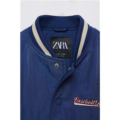 BOMBER JACKET WITH EMBROIDERED SLOGAN