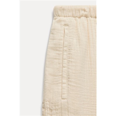 CREASED-EFFECT WIDE-LEG TROUSERS