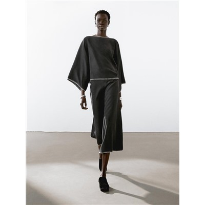 Cape blouse with batwing sleeves