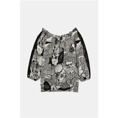 Blusa blanca y negra encaje mangas